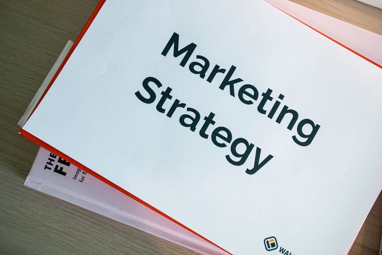 Home A marketing strategy document displayed on a desk, showcasing business planning essentials.