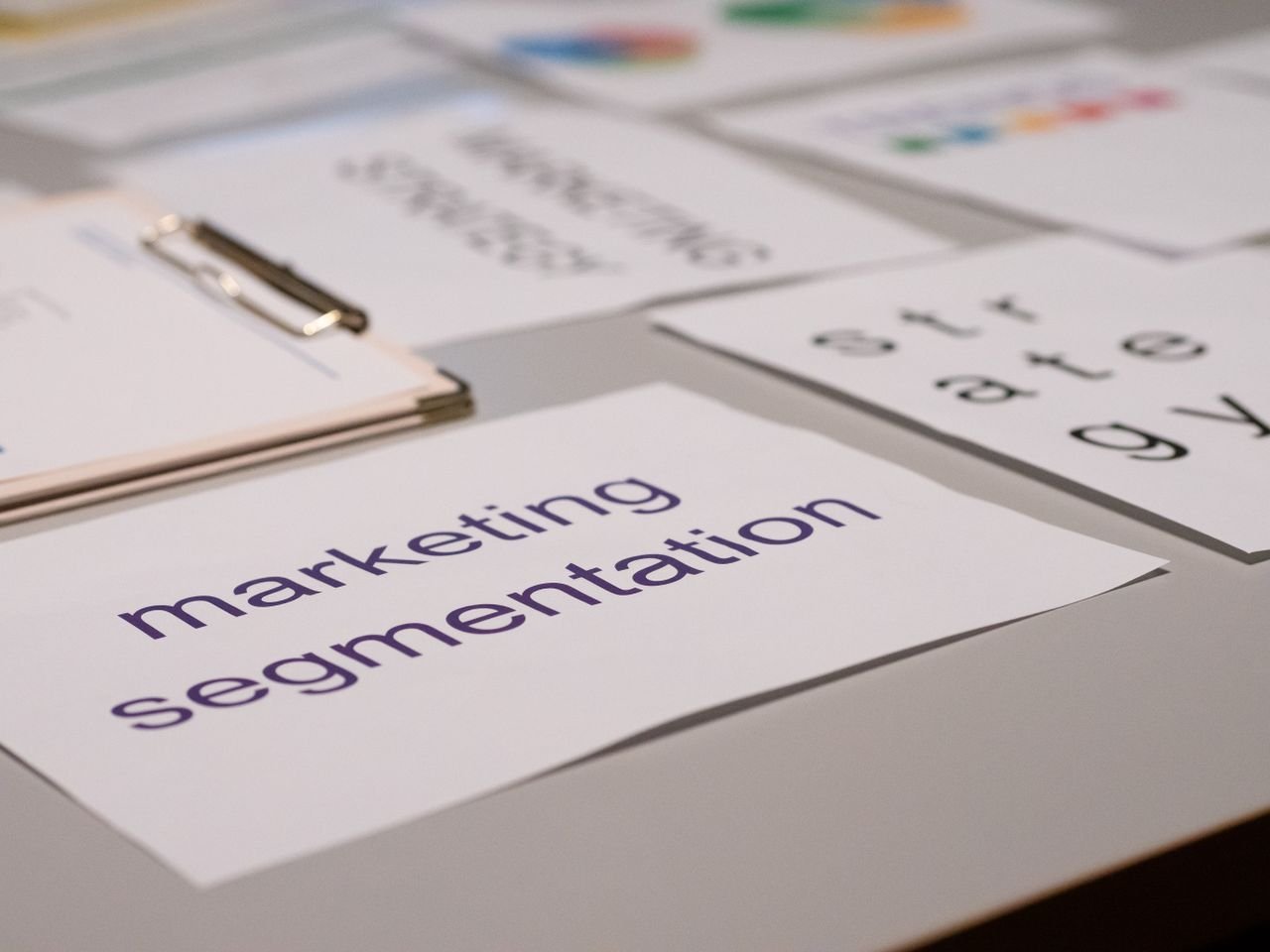 Home Close-up of various marketing documents on a desk, perfect for business and strategy discussions.